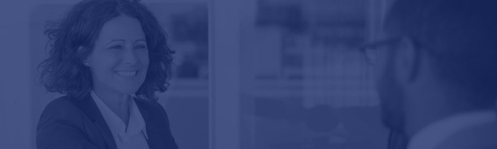 Smiling business professional representing Franklin Park Senior Living management services, featured in the contact page banner.